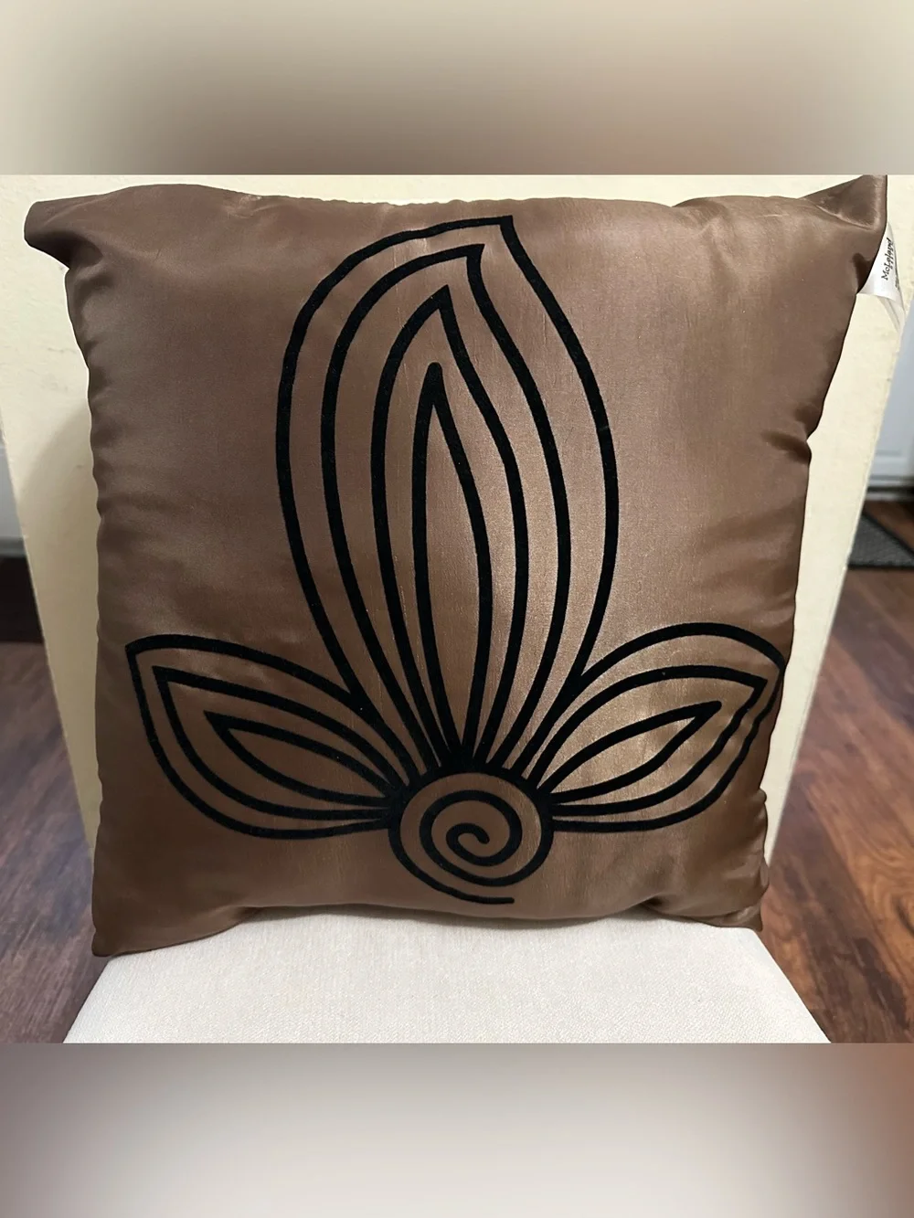 Decorative Throw Pillow with Black Floral Motif on Taupe